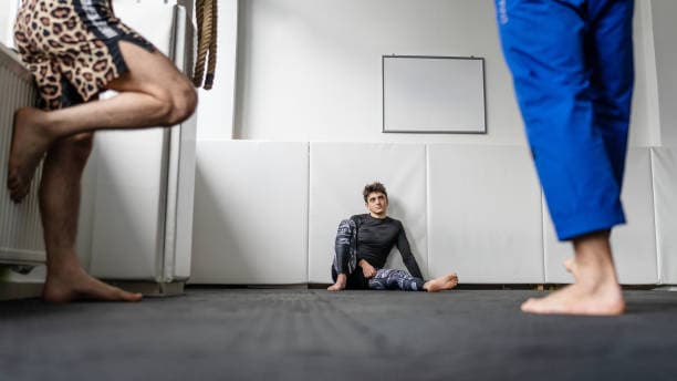 Alt A guy sitting on the mat thinking